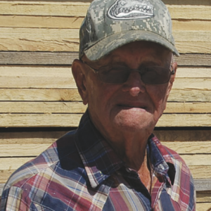 Photo of Mr. Vernon Gutherie, he is wearing a camo FL gators hat and a red, white, and blue flannel shirt